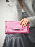 Pink clutch bag with chain strap (British brand)