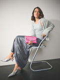 Pink clutch bag with chain strap (British brand)