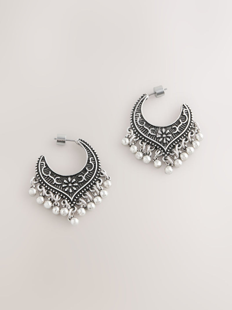 Burnished silver tone drop hoop earrings, imported from the UK