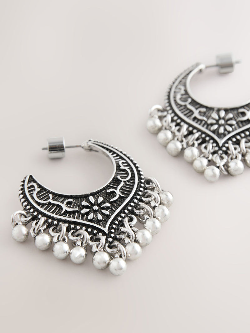 Burnished silver tone drop hoop earrings, imported from the UK
