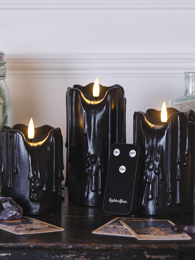 Lights4fun TruGlow black dripping wax LED candle trio 15cm, UK version