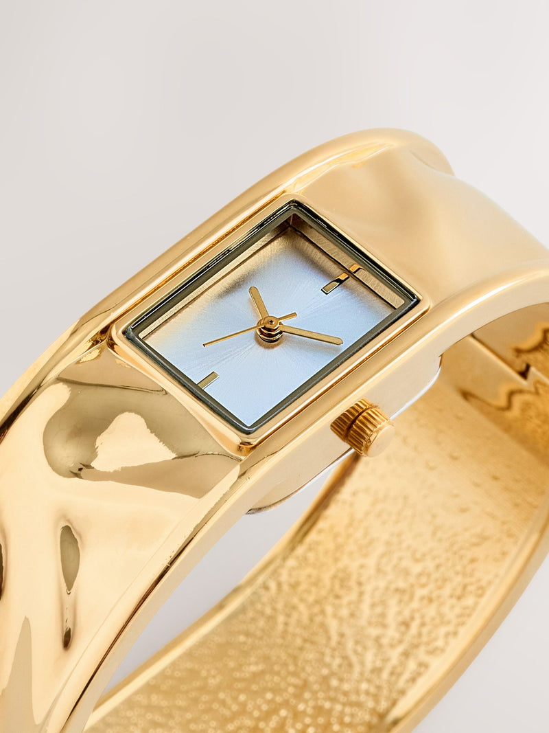 Gold tone hinged bangle watch cuff bracelet (British brand)