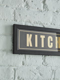 Black and gold Kitchen Disco framed wall art, 14x71cm - British product