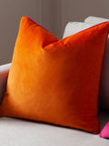 Furn orange velvet cushion with piped trim (British brand)