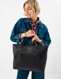 Accessorize faux leather tote bag with gold hardware, imported from the UK