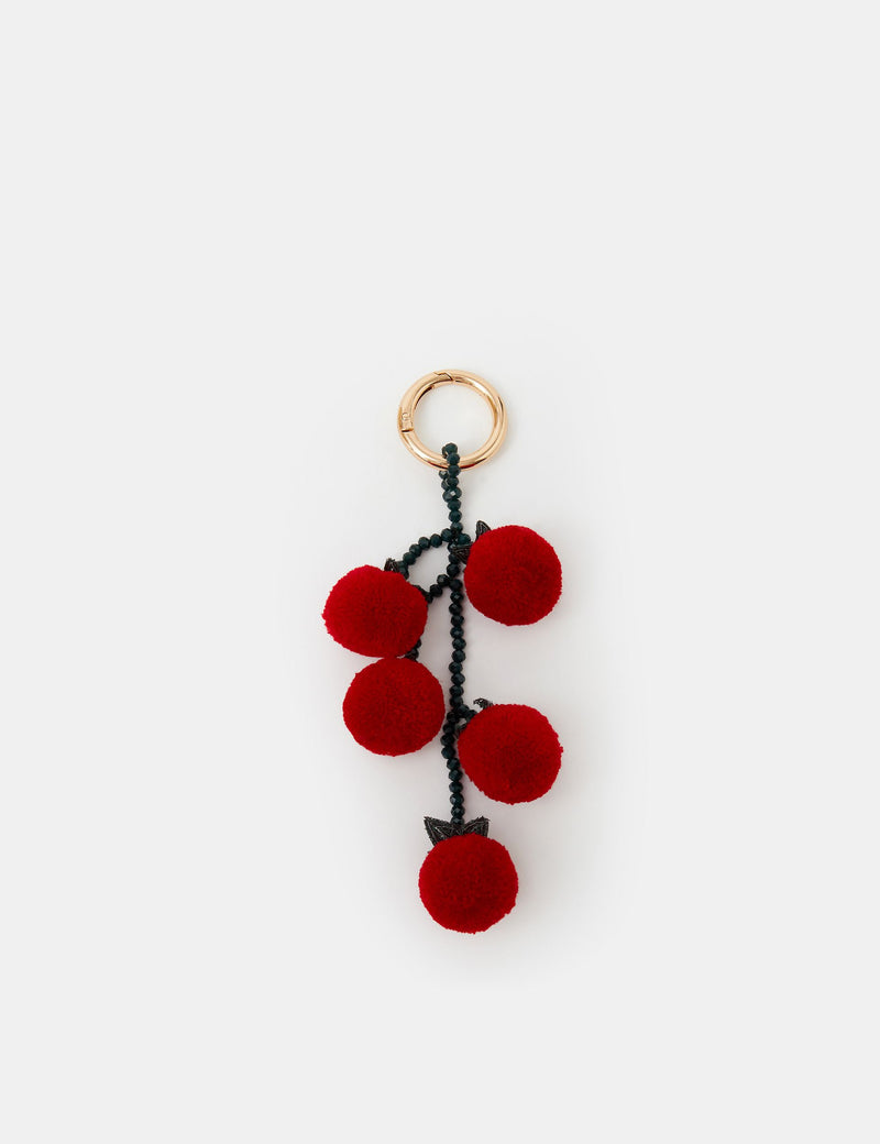 Accessorize fluffy tomato bag charm with pom-pom cherry tomatoes, imported from the UK
