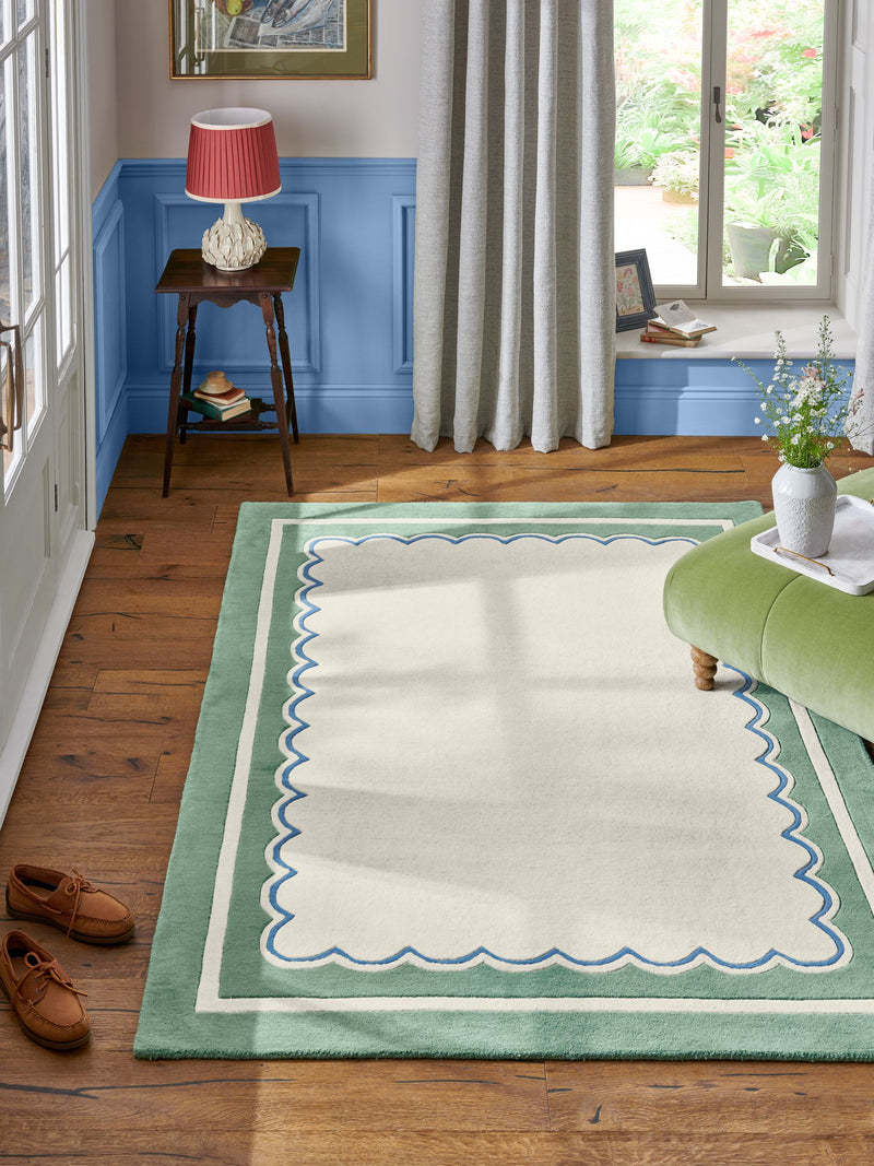 Joules sage green wool rug with scalloped border, imported from the UK