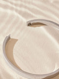 Silver tone stainless steel bangle (British brand)