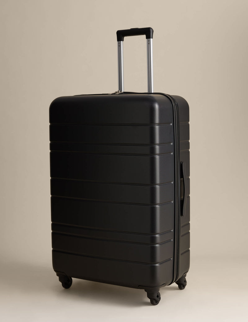 Pisa large hard shell suitcase with four wheels - British product