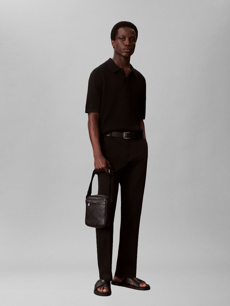 Calvin Klein black embossed emblem reporter bag, UK version