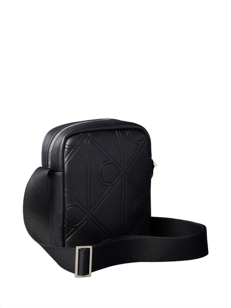Calvin Klein black embossed emblem reporter bag, UK version