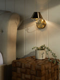 Brushed brass rechargeable wall light with warm white light, imported from the UK