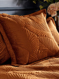 Paoletti orange quilted velvet cushion 60cm, UK version