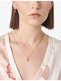 Selda J initial 14ct rose gold huggie earring, imported from the UK
