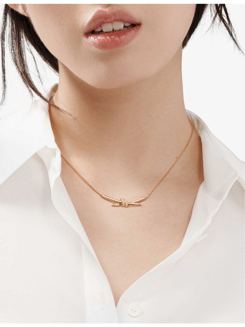 Tiffany & Co. 0.25ct diamond rose-gold knot pendant, imported from the UK