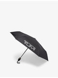 TUMI logo-print shell umbrella in medium size, imported from the UK