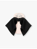 Kitsch bow-shaped fabric hair clip with oversized bow, imported from the UK