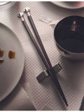 Alessi wood and stainless-steel chopsticks with fish-shaped stand 24cm, UK version