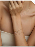 Astrid & Miyu Cosmic Star 14ct yellow-gold charm bracelet - British product