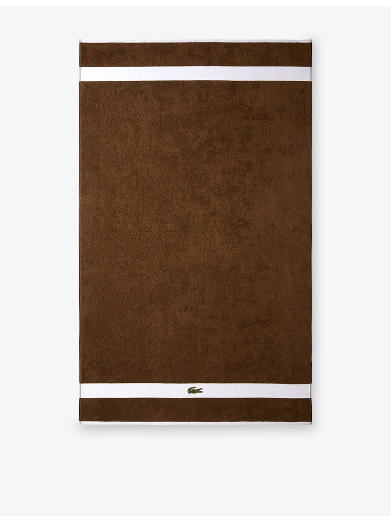 Lacoste cotton towel with woven stripe and crocodile logo - British product