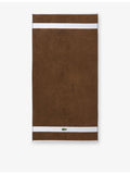 Lacoste cotton towel with woven stripe and crocodile logo - British product