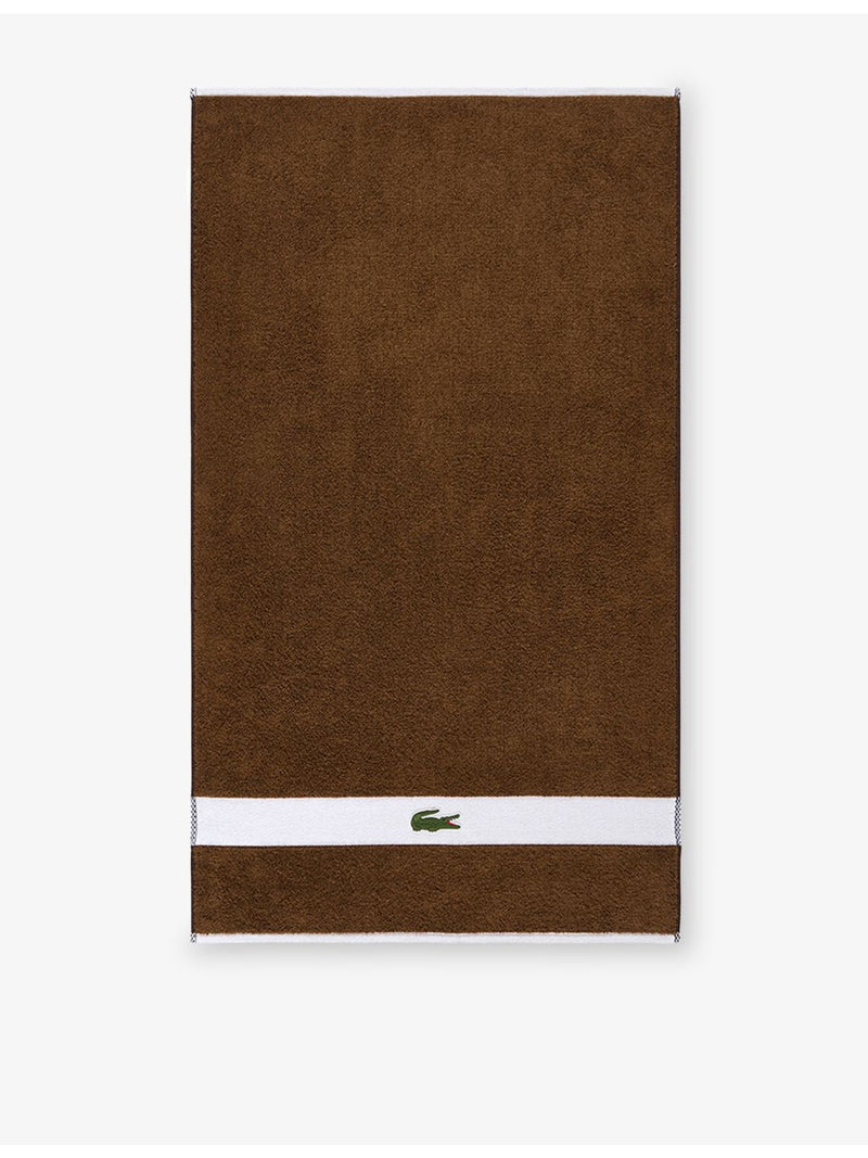 Lacoste cotton towel with woven stripe and crocodile logo - British product