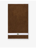 Lacoste cotton towel with woven stripe and crocodile logo - British product