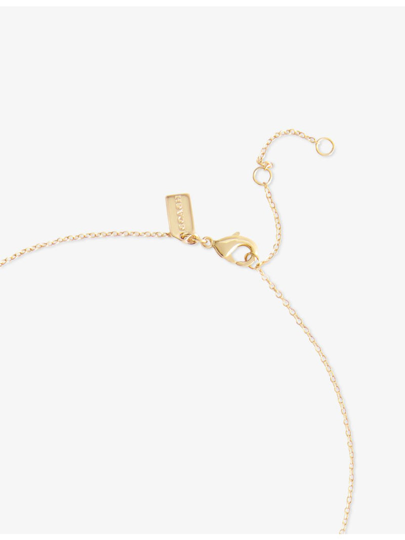 Coach cherry gold-plated brass and enamel pendant necklace, imported from the UK