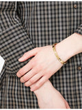 Coach gold-plated brass bangle with crystals, imported from the UK