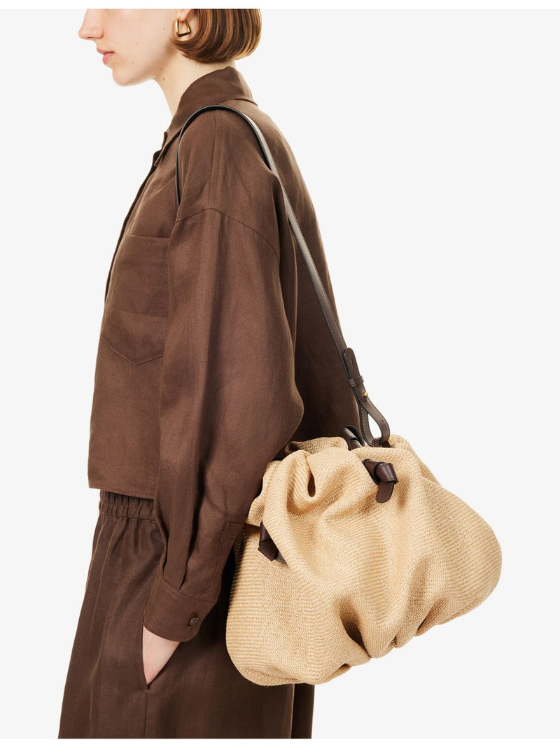 Neous Taurus Dumpling raffia shoulder bag with leather trims (British brand)