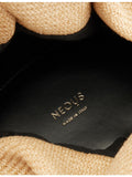 Neous Taurus Dumpling raffia shoulder bag with leather trims (British brand)