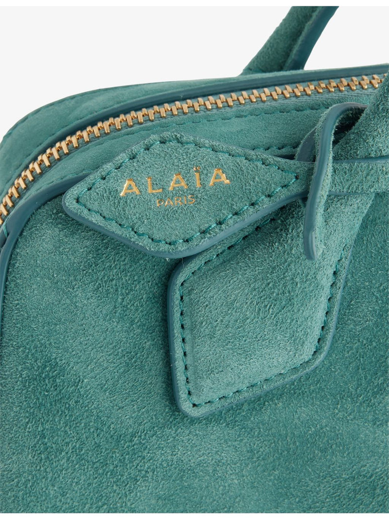 Alaïa suede clutch bag with gold-toned hardware, imported from the UK