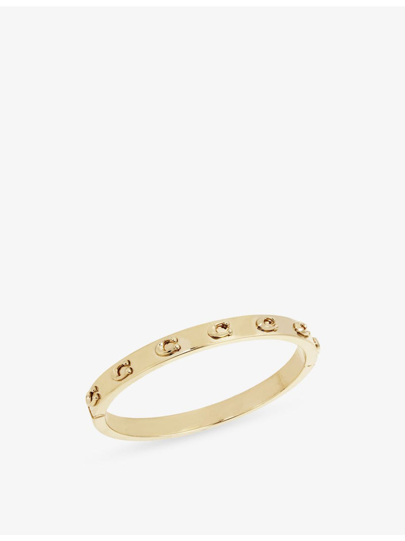 Coach gold-plated brass bracelet with sculpted C logo, imported from the UK