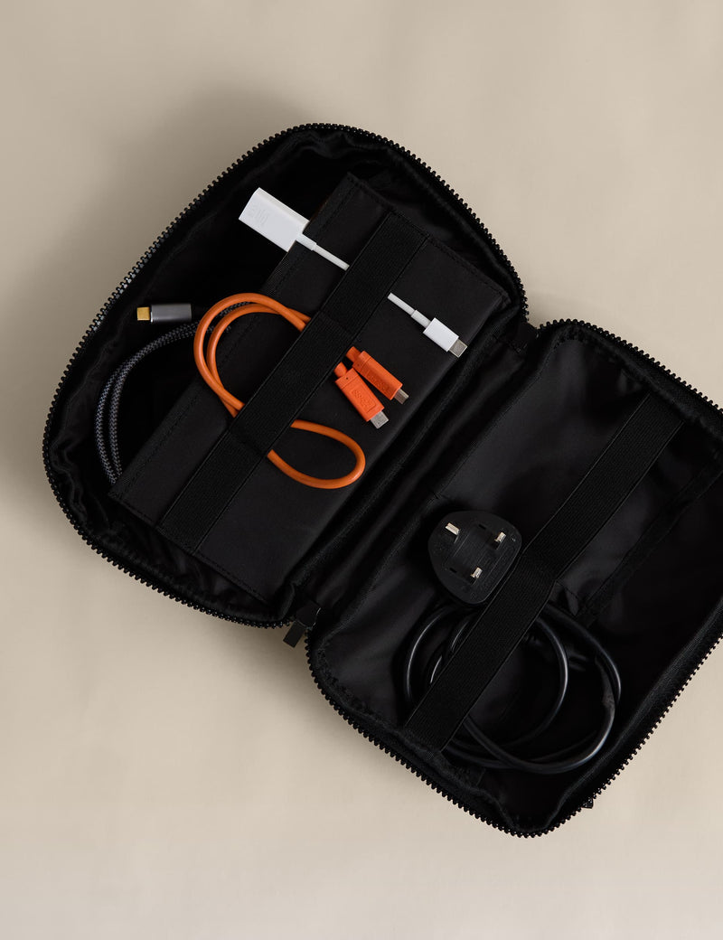 Rubberised travel tech organiser with compartments and secure zip fastenings, UK version