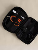 Rubberised travel tech organiser with compartments and secure zip fastenings, UK version