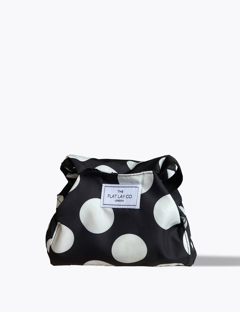 The Flat Lay Co. open flat makeup bag with double spots design, 52cm diameter, imported from the UK