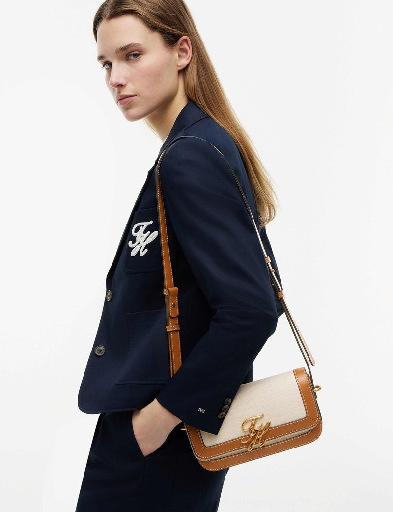 Tommy Hilfiger Script Canvas cross body bag with leather trim, UK version