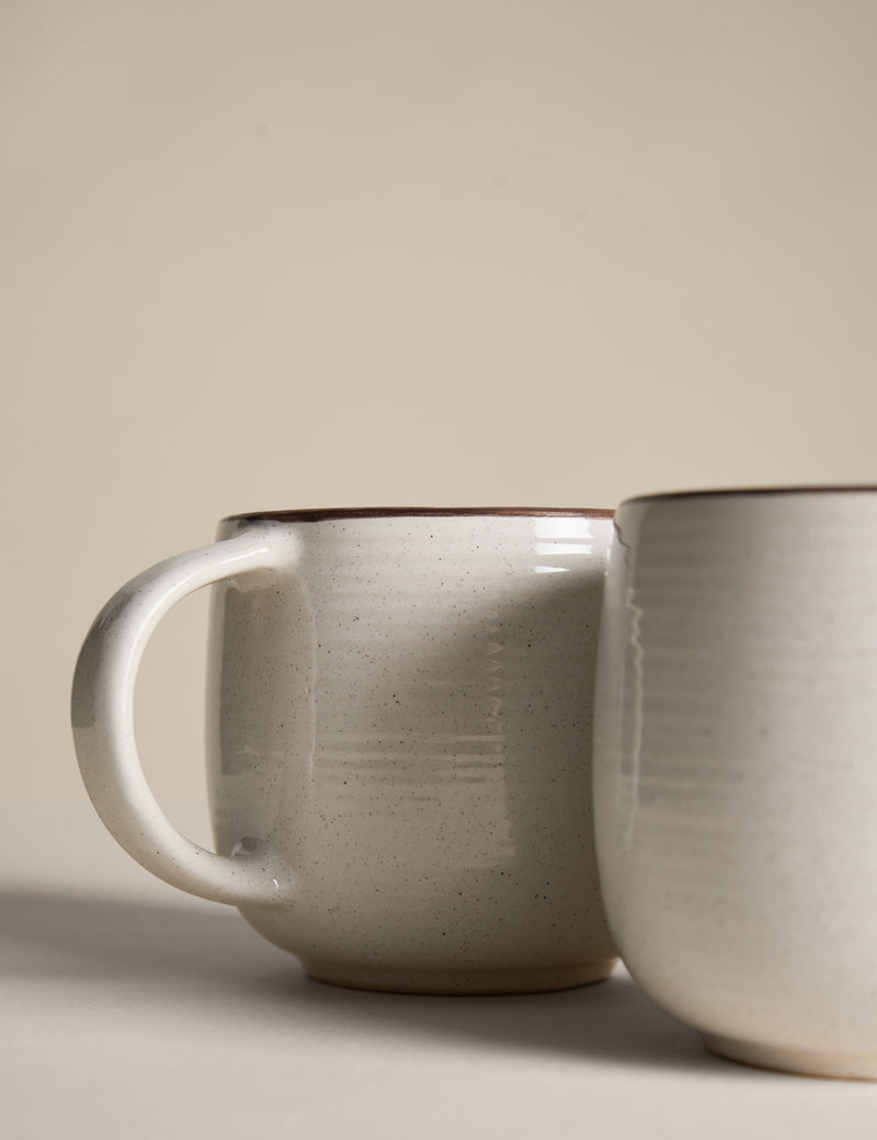 Set of four speckled ceramic mugs with contrast rims - British product