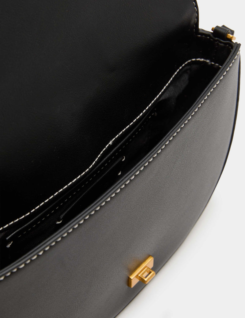 M&S shoulder bag with adjustable strap and compact design (British brand)