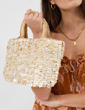 Accessorize straw embellished grab bag with raffia and mother-of-pearl, imported from the UK