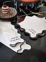 Serviettes en coton Rockett St George noires et blanches « Première bouchée », lot de 4