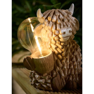 Brown Highland Cow solar light, hand-painted garden decor (British brand)