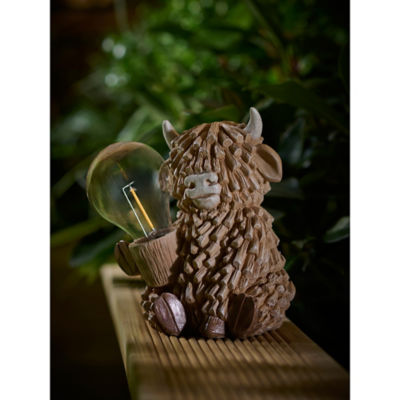 Brown Highland Cow solar light, hand-painted garden decor (British brand)