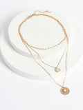 Gold tone floral 3 row necklace with shell pendant, UK version