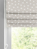 Roman blind with ditsy stars pattern in natural colour, imported from the UK