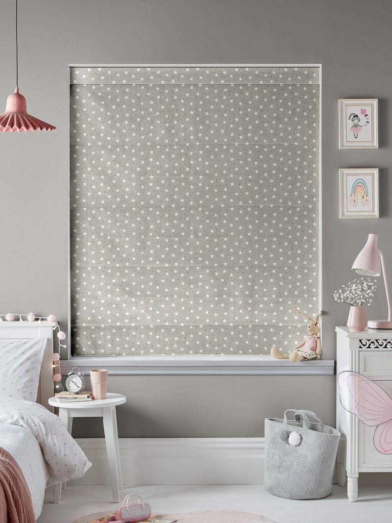 Roman blind with ditsy stars pattern in natural colour, imported from the UK