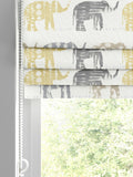 Roman blind lemon yellow with elephant pattern, imported from the UK