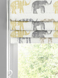 Roman blind lemon yellow with elephant pattern, imported from the UK