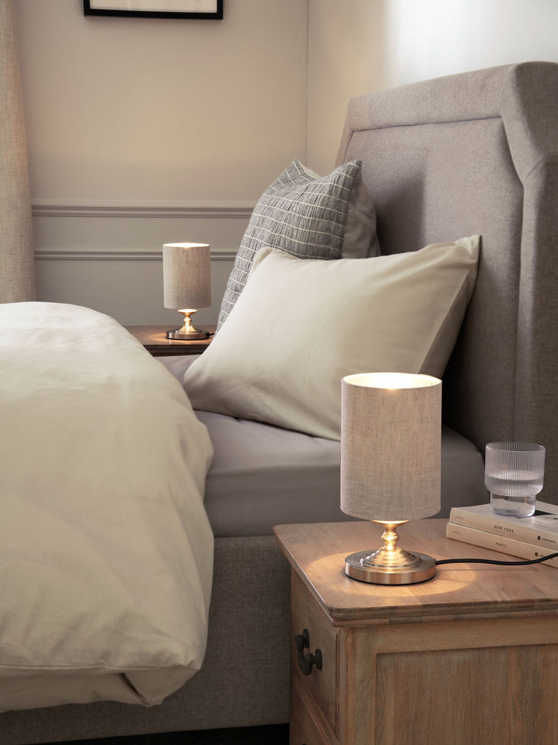 Brushed nickel Burford bedside table lamp with oatmeal shade, UK version