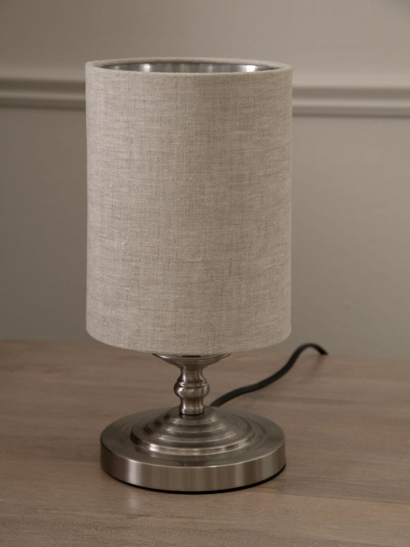 Brushed nickel Burford bedside table lamp with oatmeal shade, UK version